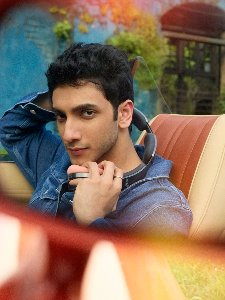 Vedang Raina smiling in a candid moment from an editorial shoot