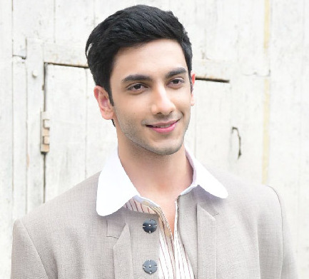 Vedang Raina IMDb profile headshot with a serious facial expression