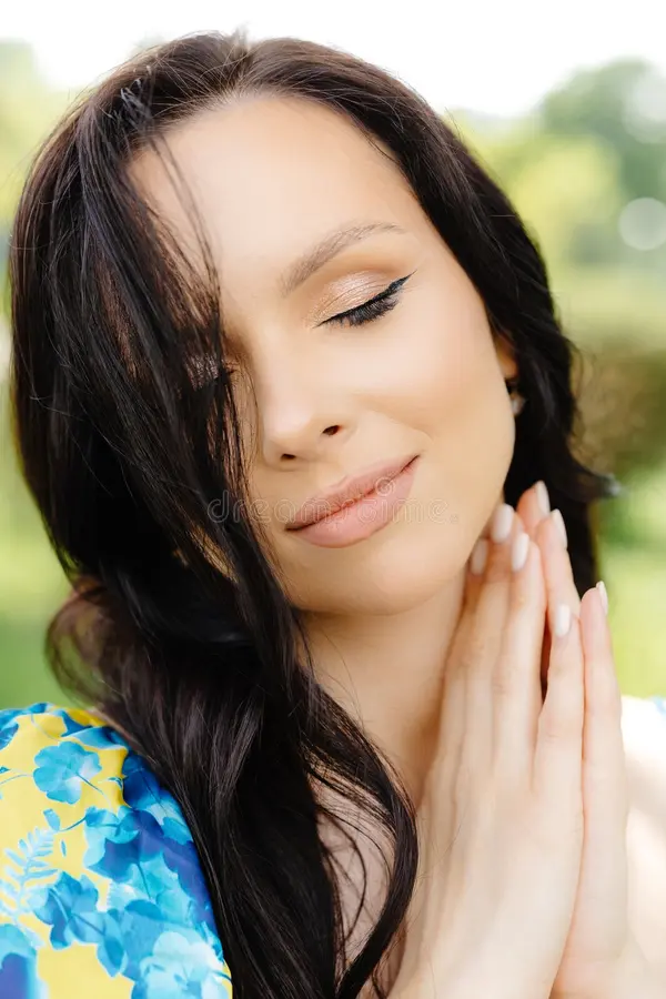 Young brunette woman posing thoughtfully